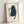Whimsical black cat observing ornamental fish, illustrated in minimalist line art with cream and navy tones in peaceful Japandi style.