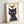 Contemporary wall art depicting a black cat and yellow bird in minimalist style using bold lines and a cream background, evoking gentle humor.