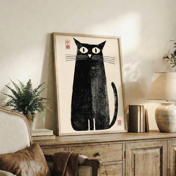 Woodblock-inspired black cat with sweeping tail on cream background, minimalist line art print with bold graphic presence framed as wall art.