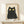 Whimsical cat illustration in minimalist line art, capturing a slightly mysterious expression with black ink accents and warm cream and yellow details.