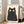 Black cat line drawing with retro charm and playful character, featuring a simplified minimalist style in black with cream and yellow highlights.