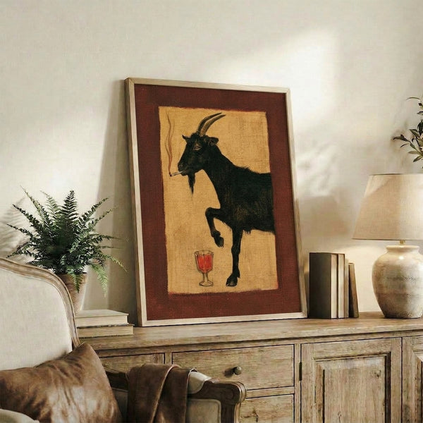 Quirky folk art print featuring an anthropomorphic goat in Art Deco style, dressed in sophisticated attire with a cigarette and wine glass, displayed in warm cream and black with burgundy accents.