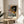 Modern home decor poster featuring Black Mirror Anemones: a striking vase arrangement with white and coral blooms, lush greens, and bold black strokes on a rich blue background in expressive Impressionist style.