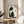 Serene Japanese woodblock-inspired portrait of a black and white tuxedo kitten, minimalist composition in ink tones matted and framed as wall art.