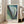 Abstract botanical-inspired poster featuring dynamic blue and green tones with flowing curves and layered forms in a modern sensual composition.