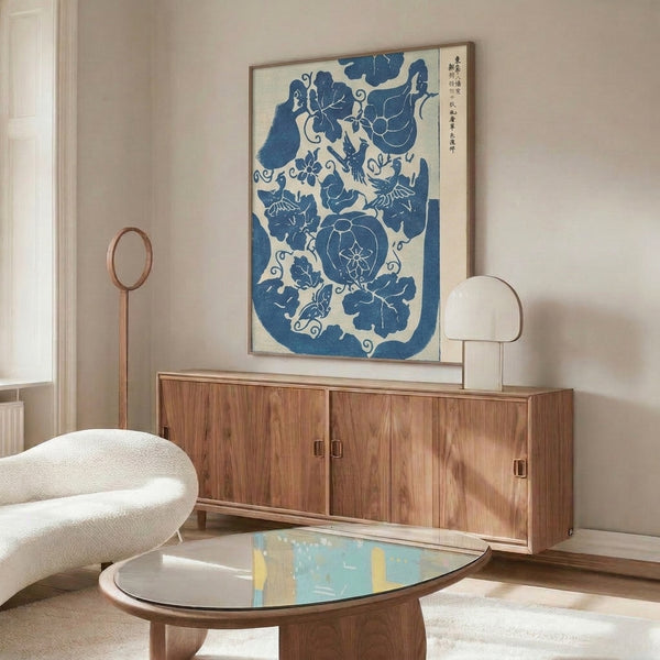Contemplative Asian cultural art print displaying traditional kimono motifs with birds and flowers in prussian blue, cream, and pale grey on wall.