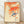 Serene Japanese woodblock print of a bird perched on an autumn branch with golden leaves and berries, rendered in cream, orange, and blue tones.