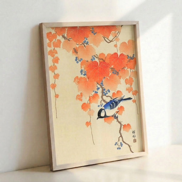 Framed Japanese woodblock poster depicting an autumn bird surrounded by ornate branches and berries in warm orange and cool blue palette.
