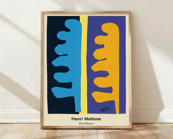 Abstract Matisse-inspired blue cut-out poster with organic shapes in bold cobalt and cream tones, framed on a wall.