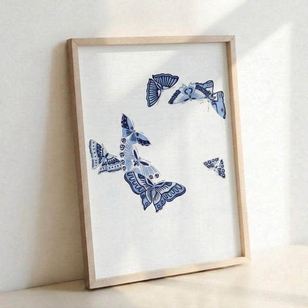 Serene butterfly illustration in indigo tones with flowing minimalist lines on light background, capturing quiet elegance of japandi design.
