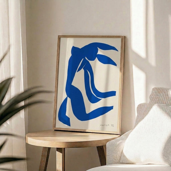 Wall art depicting a serene figure with flowing blue locks in a simplified, modern artistic approach emphasizing color and form over detail.