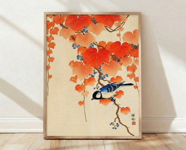 Framed Japanese woodblock-style poster featuring a serene jay bird perched among autumn vines with burnt orange leaves and deep blue accents, rendered in earthy Japandi aesthetic.