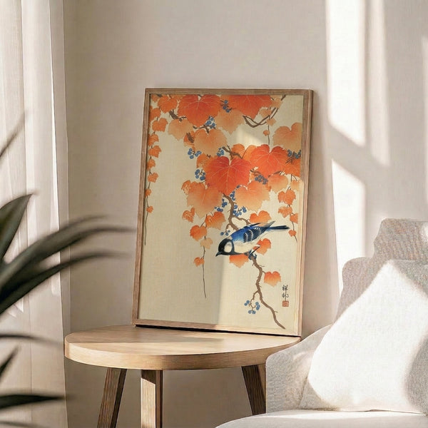 Tranquil framed art featuring a blue jay amidst falling leaves and vine branches in burnt orange, cream, and sage—a seasonal Japanese woodblock aesthetic piece.