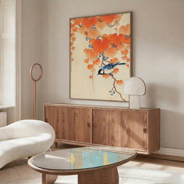 Framed nature-inspired artwork of a contemplative jay bird surrounded by seasonal branches and berries in cobalt blue, burnt orange, and cream, honoring Japanese artistic tradition.