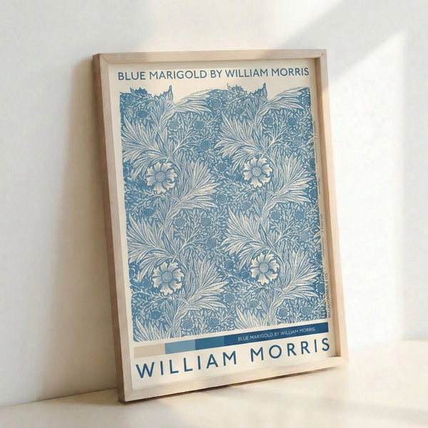Framed Art Nouveau wall art displaying stylized marigold flowers in teal and navy with intricate leaf patterns on cream, elegant botanical design.