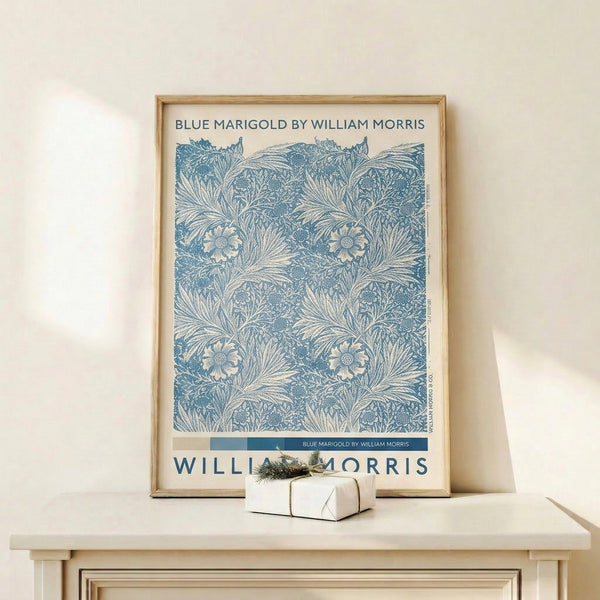 Classic William Morris botanical poster with marigold flowers in rich blue hues and ornamental leaves, vintage art style framed on wall.