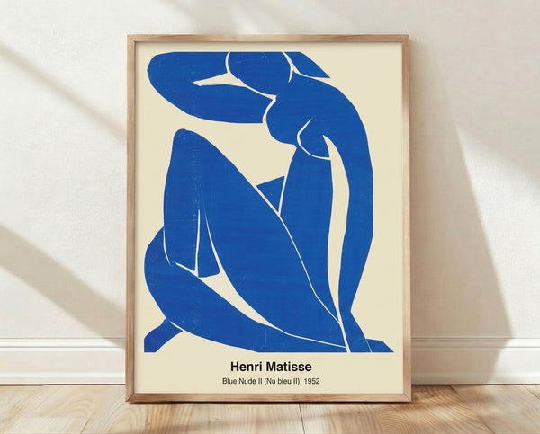 Abstract modern art print of a reclining female figure rendered in bold blue lines and shapes against a neutral background, inspired by Matisse's minimalist style.