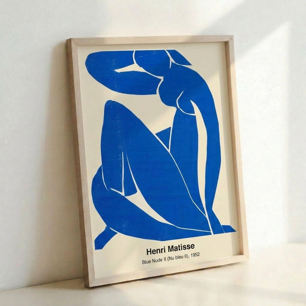 Contemporary wall art featuring a reclining woman depicted through bold blue curves and geometric abstraction in a minimalist composition.