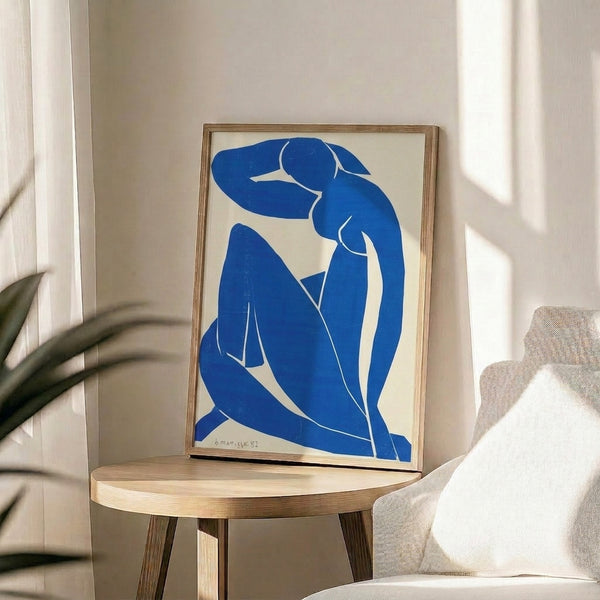 Matisse's celebrated Blue Nude II framed artwork, abstract composition merging figure and form in cool blue tones against warm background.