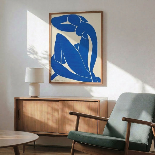 Henri Matisse abstract print Blue Nude II featuring a serene reclining figure in vibrant shades of blue, framed wall art for modern spaces.