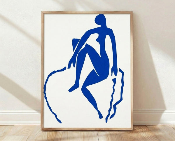 Abstract framed poster of a blue cutout figure in dynamic motion, inspired by Matisse's bold minimalist style with vibrant cobalt tones and curved organic shapes.