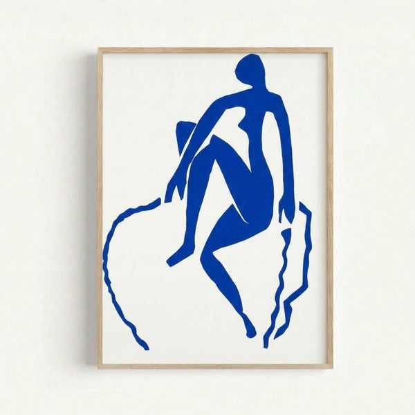 Modern art print featuring a simplified blue silhouette in a graceful jumping pose, rendered in the characteristic papier-coupé technique with warm neutral wall display.