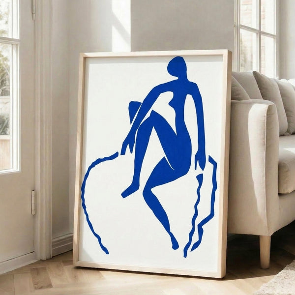 Minimalist framed print of a dynamic blue silhouette performing a jumping gesture, rendered in flat color against negative space with striking modernist composition.