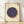 Framed vintage Japanese woodblock print depicting blueberries arranged on a cream background with navy blue and ochre tones, featuring scholarly botanical detail and traditional seal stamps.