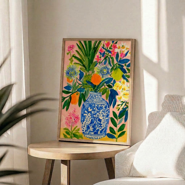 Boho wall art print featuring a blue and white chinoiserie vase overflowing with cheerful lemon, orange, and delicate floral arrangements in watercolor style.