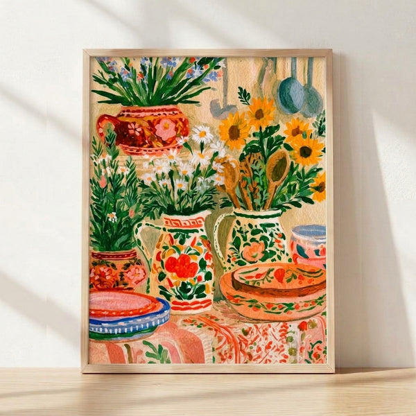 Boho watercolor still life poster featuring sunflowers, potted plants, and ceramic vases in warm terracotta, golden yellow, and forest green tones on a cream background, framed on a wall.