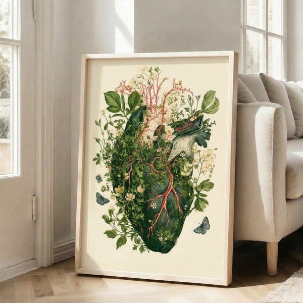 Framed anatomical heart illustration adorned with flowering branches, leaves, and fluttering butterflies rendered in muted watercolor palette of pale pink, sage green, and warm cream; contemplative nature print.
