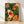 Framed boho botanical poster featuring vibrant passion fruit, berries, and blooming flowers in coral orange, magenta, and deep green against a navy blue background with gold accents.
