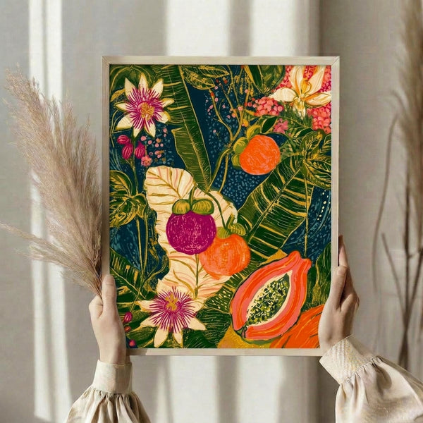 Art Nouveau-inspired botanical print with lush tropical foliage, fruit, and florals in jewel tones of magenta, emerald green, and coral on cream and navy, displayed as framed wall art.