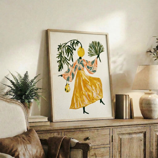 Boho watercolor art print featuring a joyful figure with citrus fruit head dressed in an ornate floral kimono, displayed as a framed poster with nature-inspired yellows and teals.