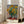 Sunflower bouquet rendered in loose Impressionist brushwork, dominated by warm golden yellows and cream hues with subtle green foliage and cool grey-blue background tones.