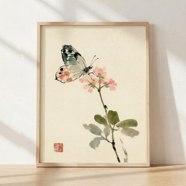 Serene watercolor and ink painting of a delicate butterfly perched on a soft pink blossom with sage green leaves, framed poster in Japandi style.