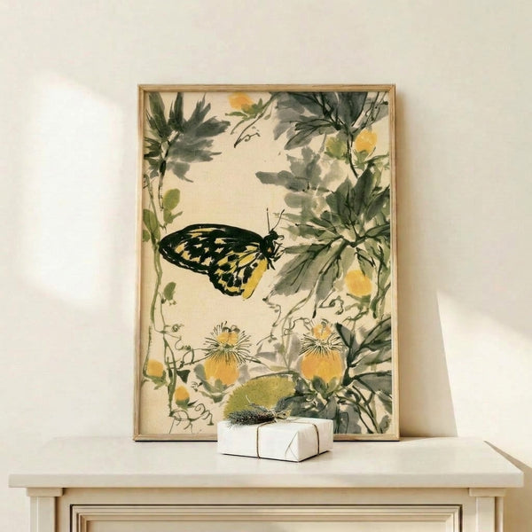 Vintage-style botanical watercolor art featuring a butterfly surrounded by flowering plants and leaves in muted greens and creams, displayed as a framed wall print.