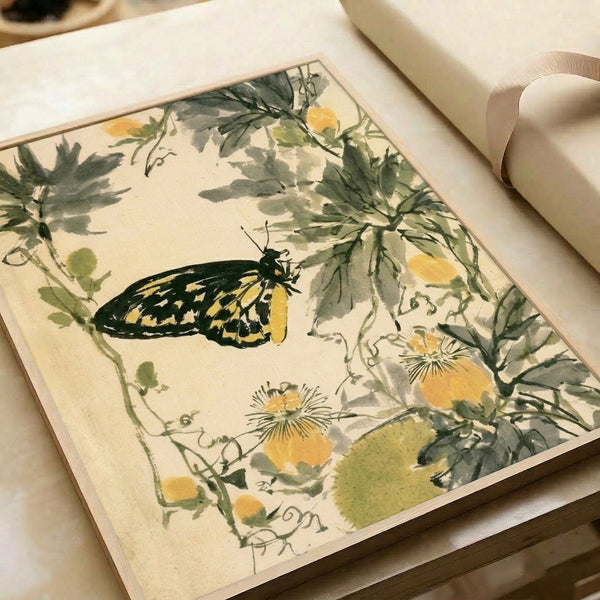 Delicate watercolor botanical print showing a butterfly among flowering stems and foliage in vintage cream and sage tones, hung as a framed wall artwork.