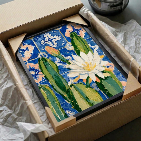 Contemporary botanical wall art print in watercolor style displaying a vibrant coral cactus flower with gold accents on geometric cobalt blue tiles, boho framing.