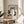 Minimalist framed cat artwork in traditional Japanese ink style, featuring contemplative brushstrokes in black, gray, and cream tones with scholarly refinement.