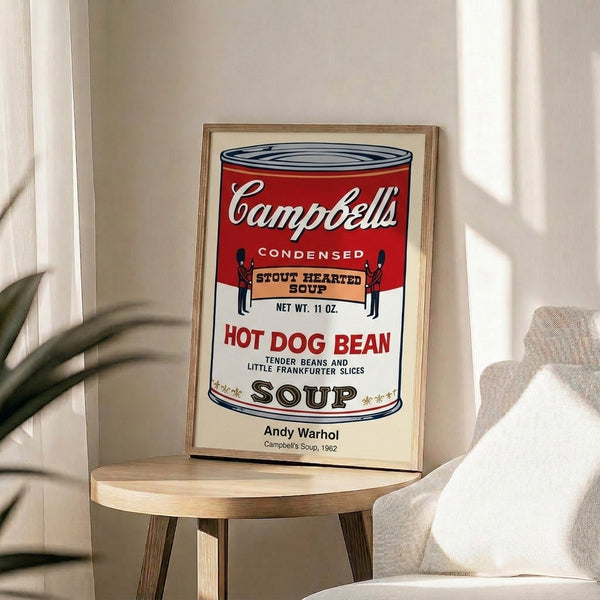 Iconic pop art piece showing a Campbell's soup can in red and white with gold lettering, Warhol's commentary on consumerism and repetition.