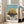 Studio Ghibli-style wall art showcasing a majestic floating fortress amid clouds, evoking adventurous wonder through gentle tones of teal, cream, and charcoal.