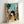 Japanese anime poster depicting a girl and cat in a quaint alley setting with vintage architectural details, turquoise walls, and nostalgic street elements.