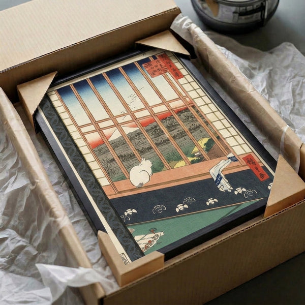 Intimate domestic scene in Japanese print style featuring a cat at windowsill with mountain vista and flowers, framed and displayed in calming indigo, cream, and terracotta.