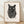 Minimalist line art poster featuring a black cat's profile merged with a fingerprint design on cream background, framed on wall.