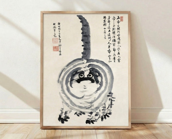Minimalist ink wash painting of a cat beside a gourd with calligraphic brushstrokes in black and gray tones on cream background, framed on wall.