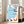 Calm, introspective line drawing of a person and orange cat in a cozy cafe moment, accented with blue and cream tones and scattered books.