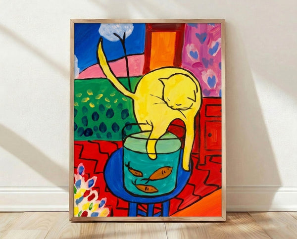 Framed poster of a black and white tuxedo cat gazing at a vibrant red fish, rendered in bold Matisse-style colors and organic shapes.