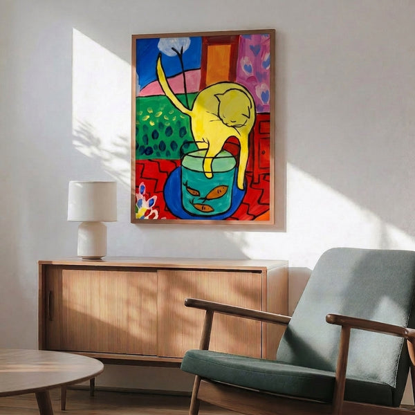 Wall art print of a feline figure and vivid red fish rendered in bold hues and flowing lines, capturing a moment of curious observation.