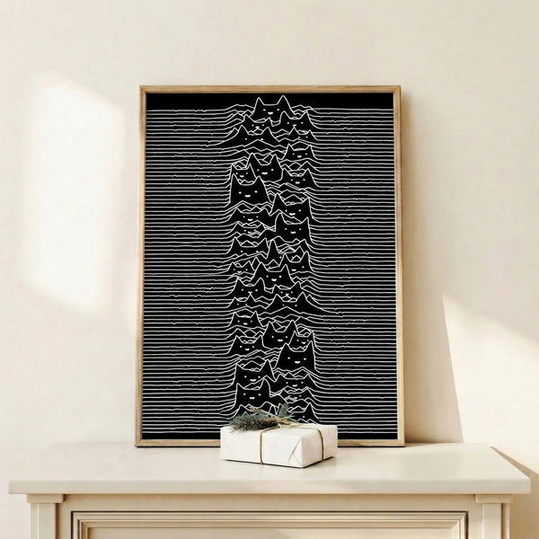 Contemporary wall art displaying a sleek black cat silhouette layered with flowing wave motifs and mountain shapes against a stark white backdrop.